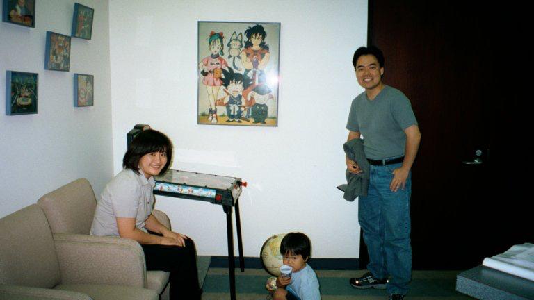 Jun Matsuo as a child at the Cloverway office, with a Dragon Ball Z poster behind him